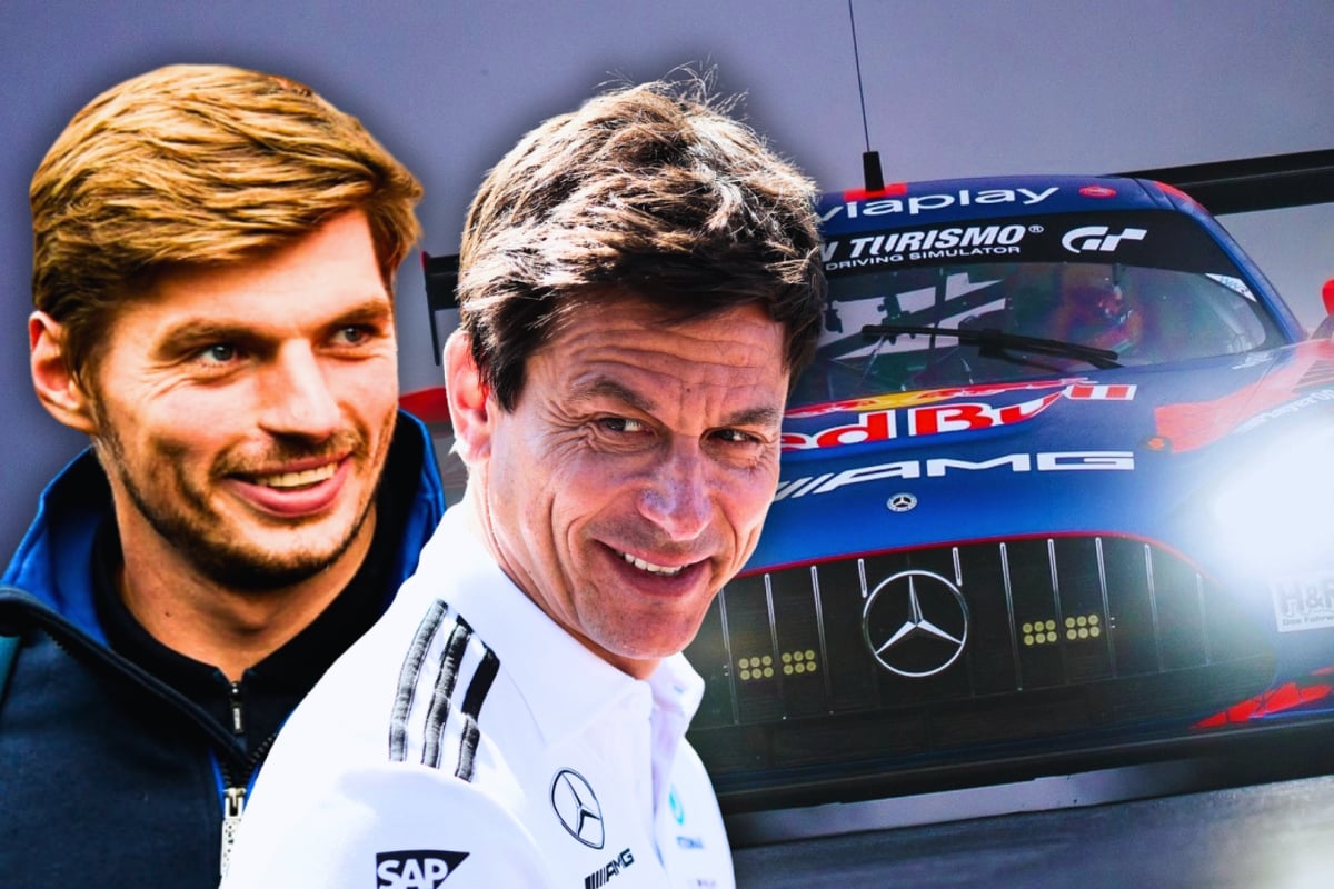 Verstappen and Wolff smiling with the Mercedes AMG car on the Nurburgring in the background