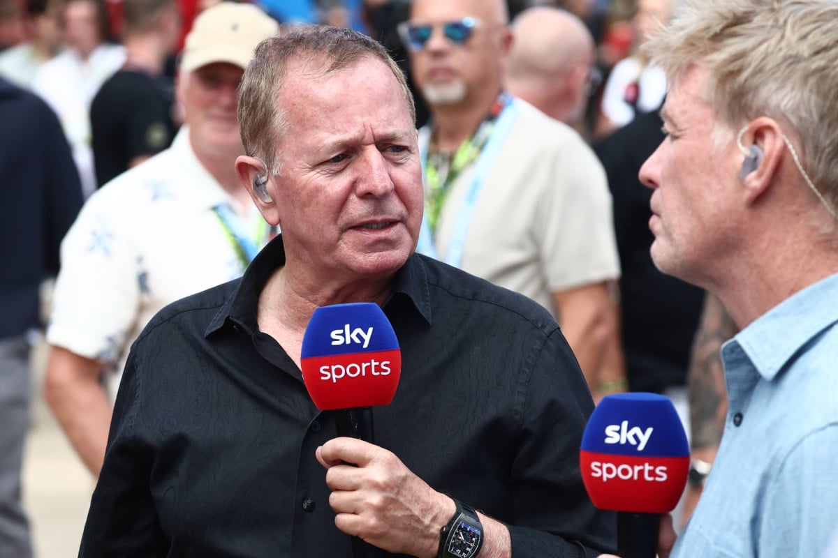 Martin Brundle talking into a Sky F1 mic
