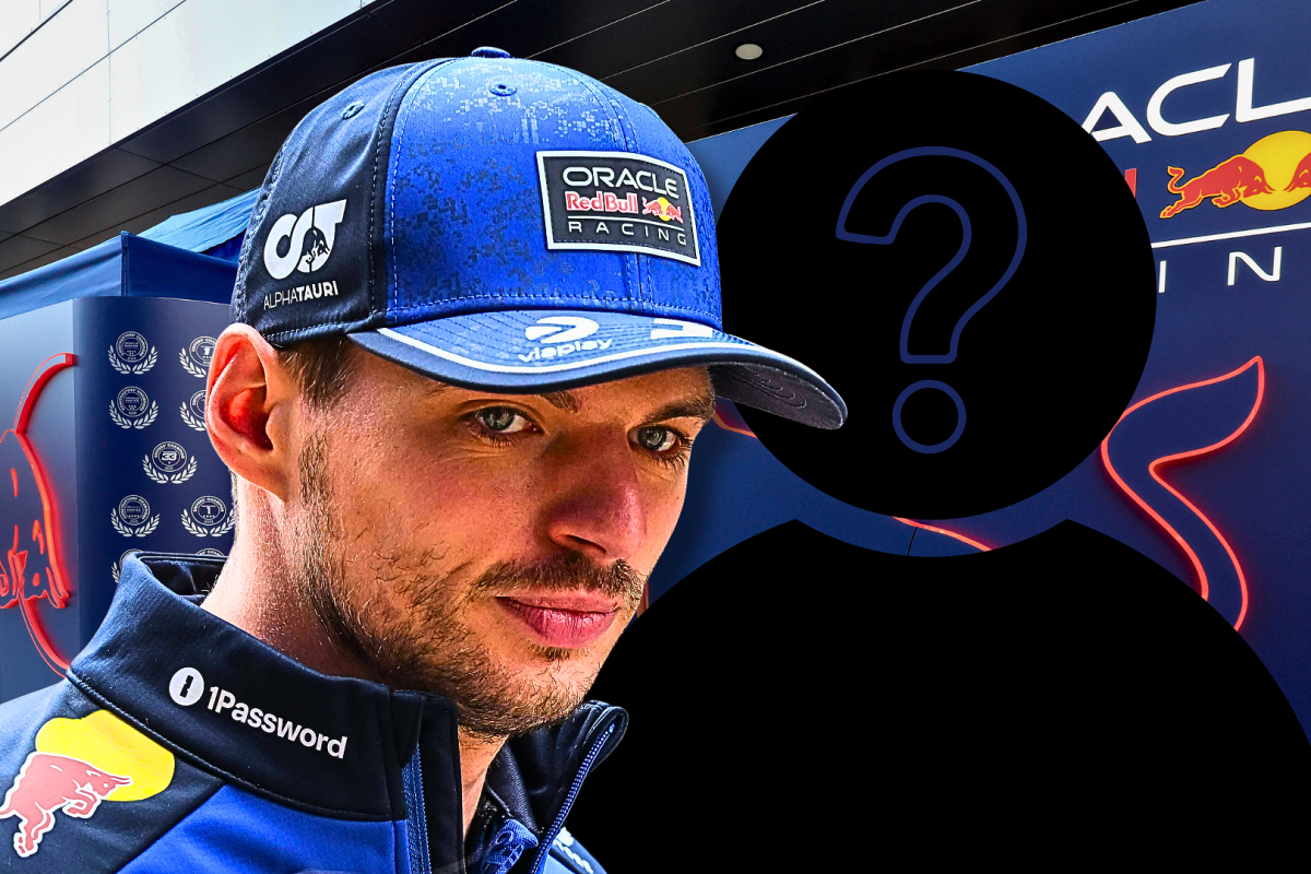 Verstappen looking confused in front of Red Bull garage with mystery driver silhouette to his right