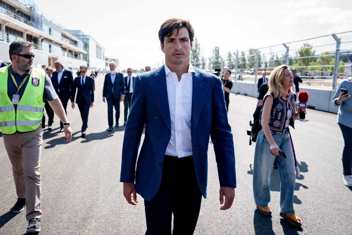 Carlos Sainz walks around the Madring track as it is being built