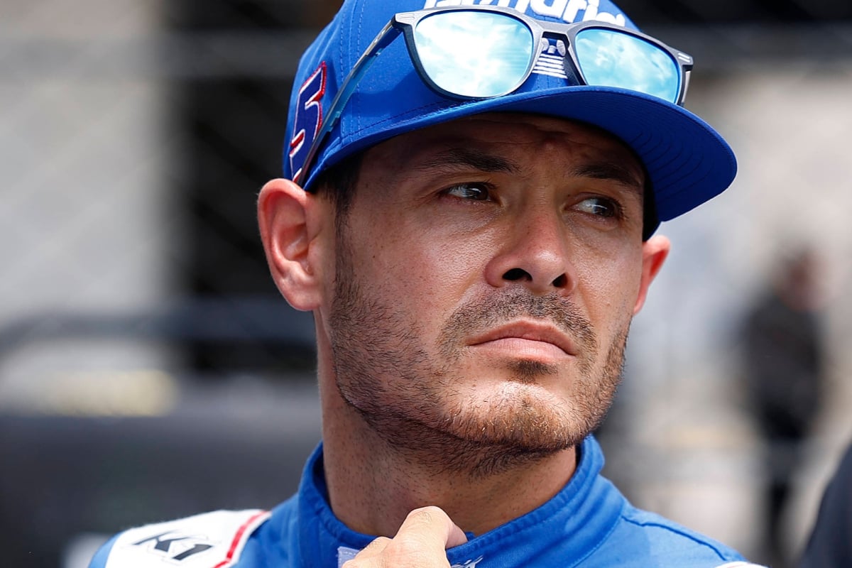 NASCAR driver Kyle Larson looking into the distance with a frown