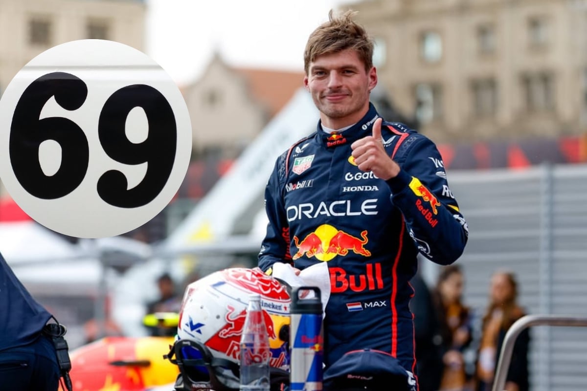Max Verstappen gives a thumbs up and smiles with the number 69 inset