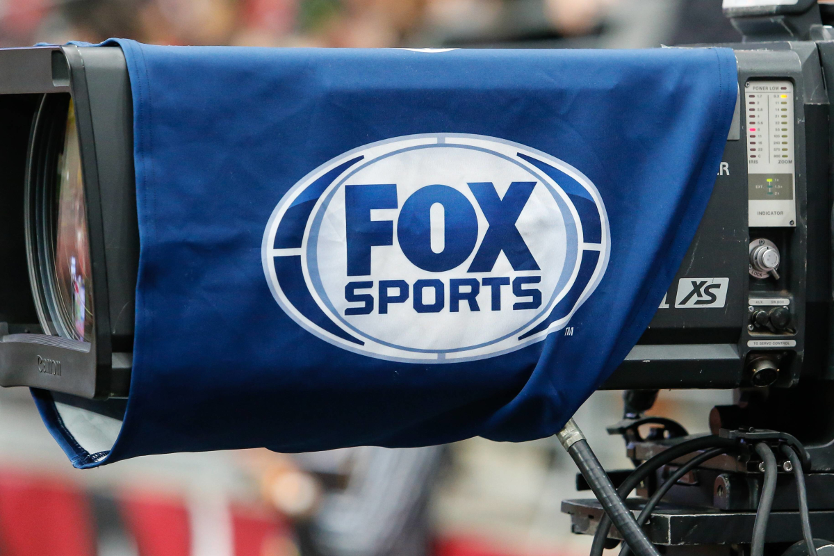 An image of the FOX Sports logo on a TV camera