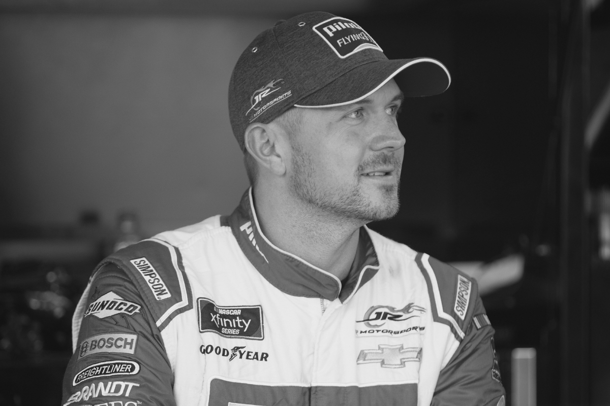 A black and white image of former NASCAR driver Michael Annett