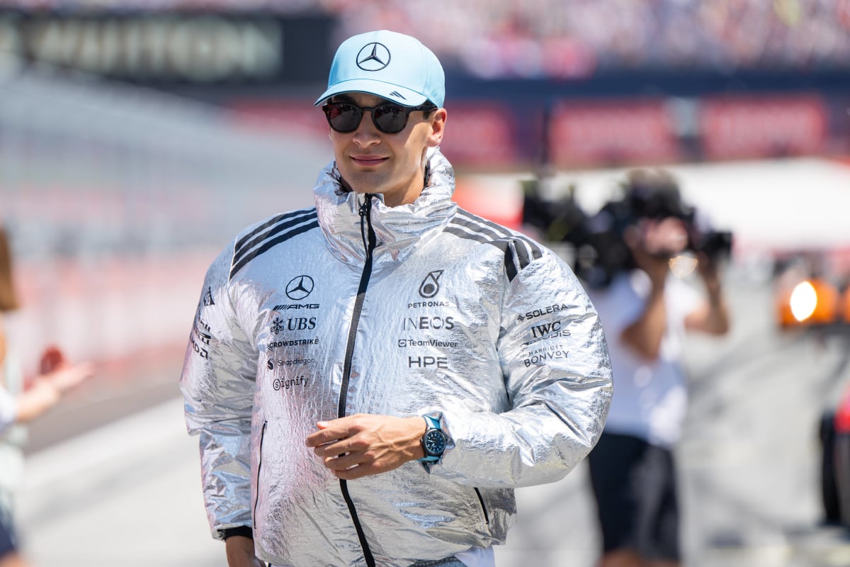 George Russell wears a big silver jacket ahead of the Austrian Grand Prix