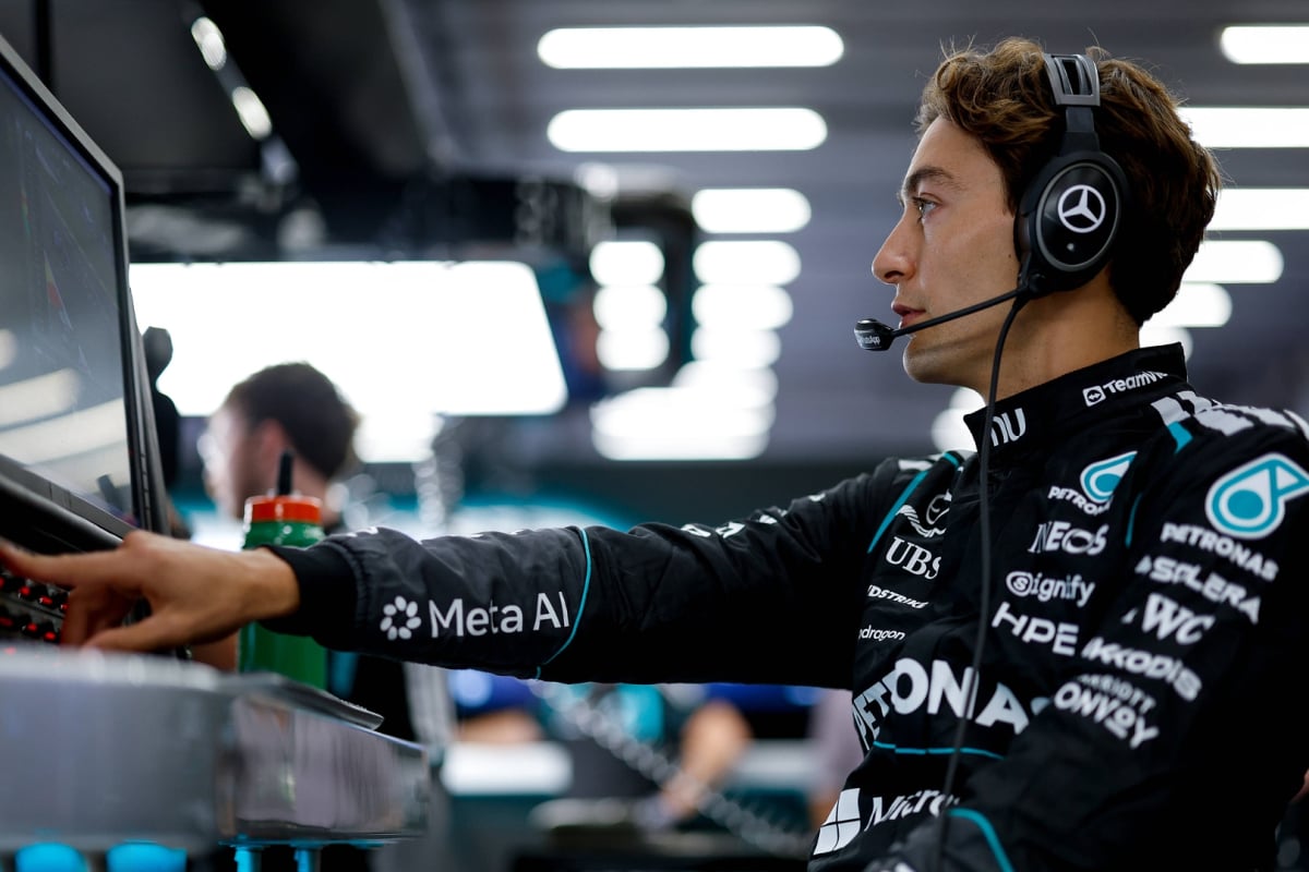 George Russell speaks into his Mercedes headset at the Belgian Grand Prix