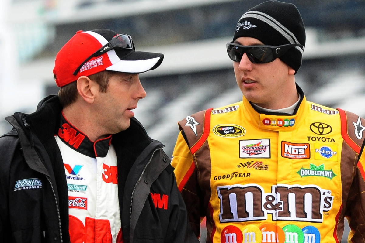 An image of Greg Biffle and Kyle Busch in conversation before a NASCAR race