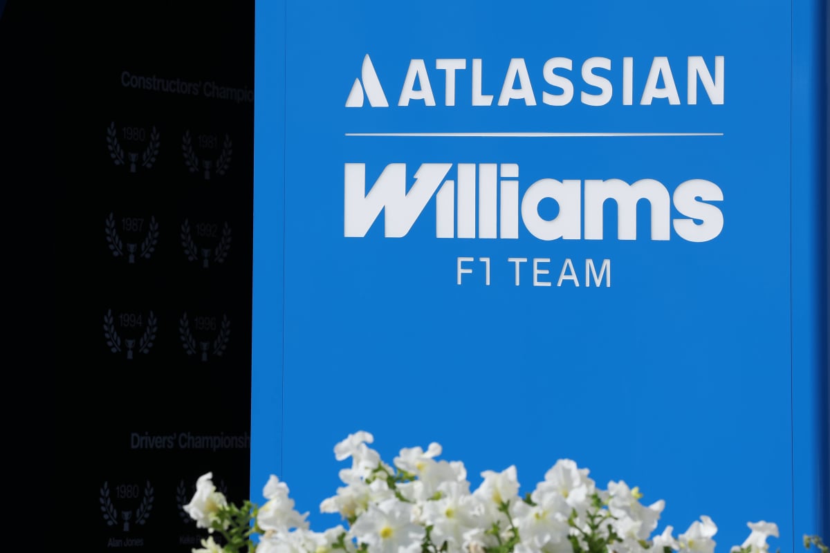 The Williams logo is shown in front of their motorhome