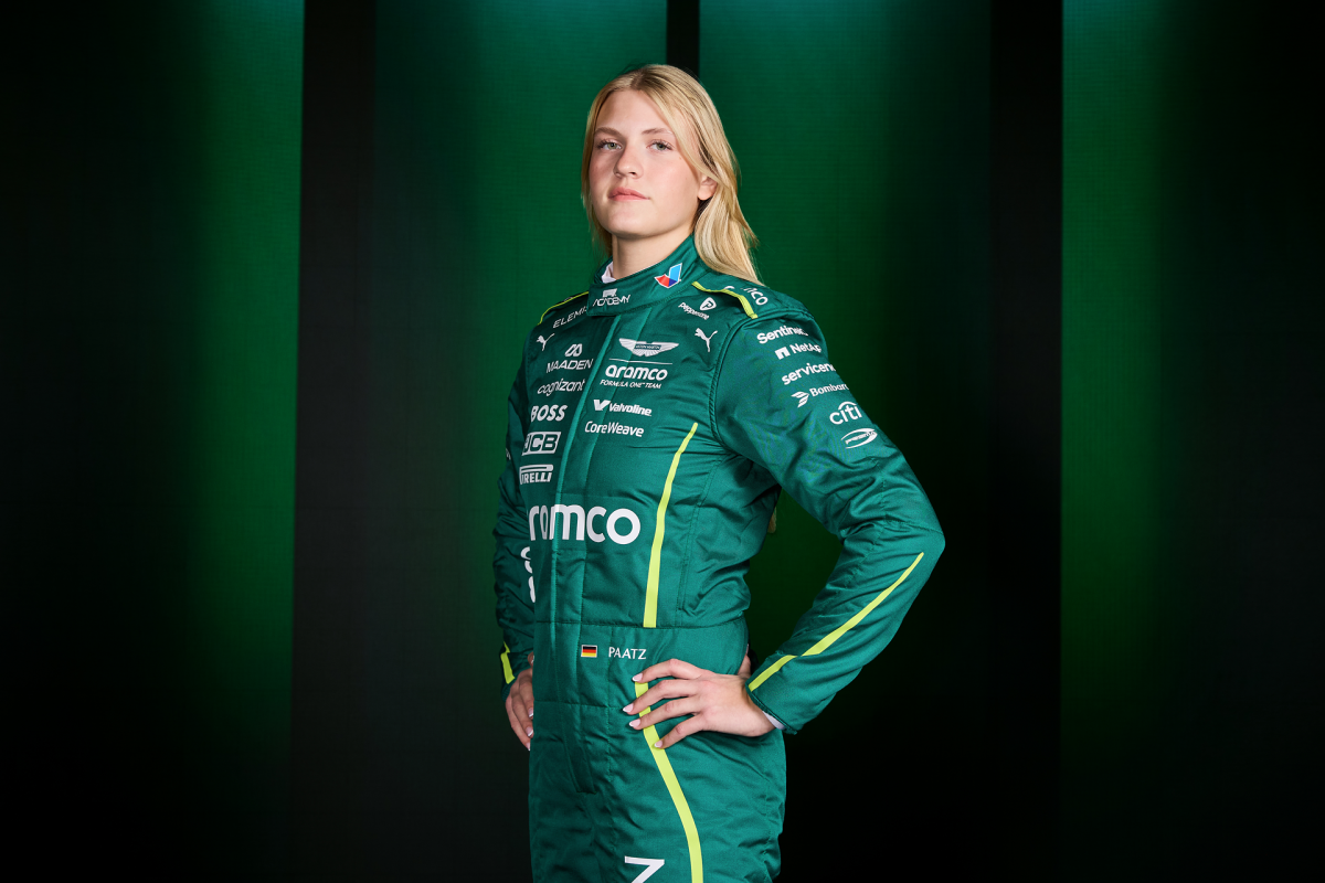 Mathilda Paatz poses in Aston Martin race overalls