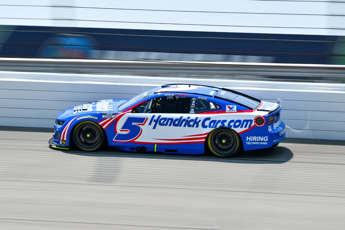An image of NASCAR star Kyle Larson driving in 2025 at Michigan International Speedway