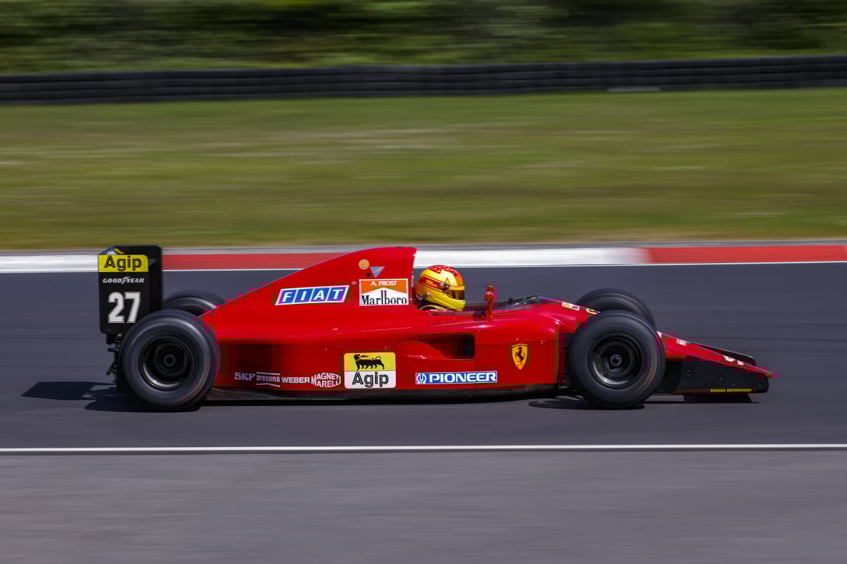 A 1992 Ferrari F1 car being driven around the Nurburgring track in 2023