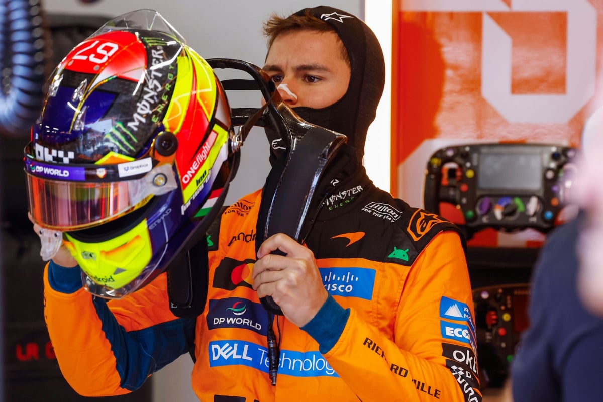 An image of McLaren test and reserve driver Leonardo Fornaroli preparing in the garage 