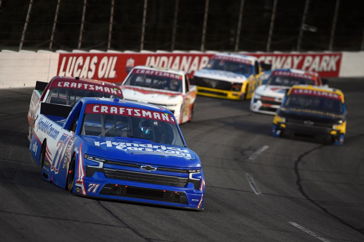 An image of a NASCAR Truck Series race at Indianapolis Raceway Park being led by Rajah Caruth