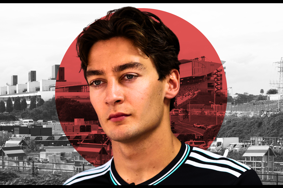 George Russell looks on with the Japan flag in the background