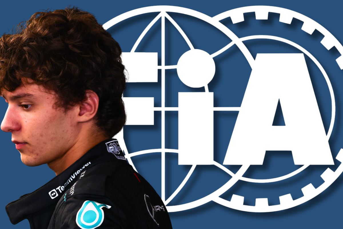 Antonelli's side profile in Mercedes race suit with blue background and white FIA logo