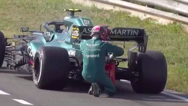 Sebastian Vettel turns fireman