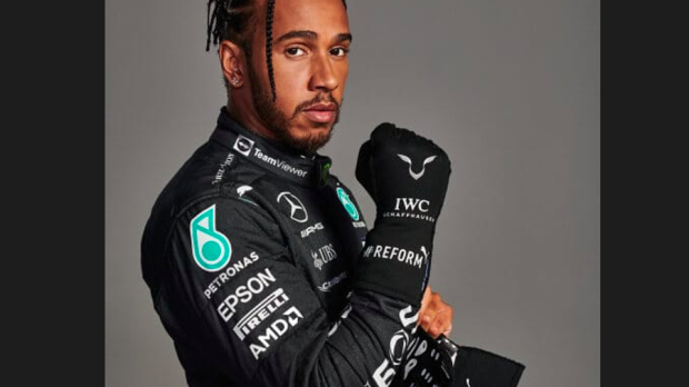 Lewis Hamilton in overalls with TeamViewer branding