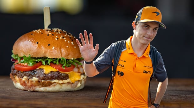 Oscar Piastri waves alongside a composite picture of a hamburger