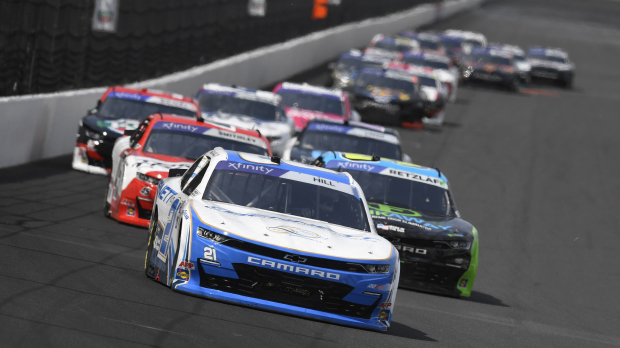An image of Austin Hill leading a NASCAR Xfinity Series at Indianapolis Motor Speedway