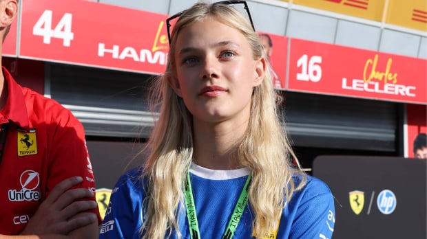 F1 Academy and Ferrari academy driver Alba Larsen outside the Ferrari garage