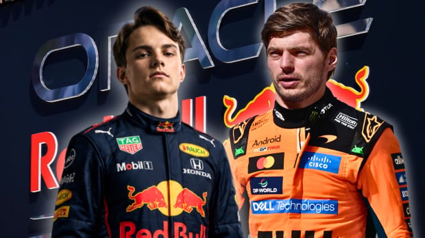 Piastri in navy Red Bull race suit next to Verstappen in papaya McLaren race suit with Red Bull Racing sign and logo as background — Photo: © IMAGO
