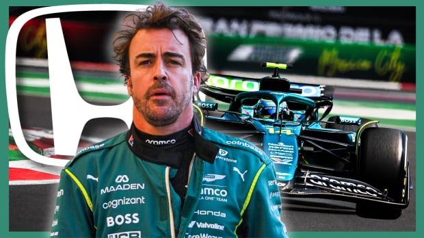 Alonso looking stressed in front of his Aston Martin F1 car on track with the white Honda logo behind him — Photo: © IMAGO