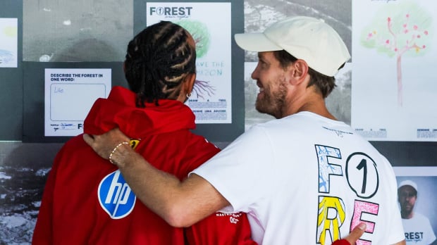 Lewis Hamilton and Sebastian Vettel stand side by side at the 2025 Brazilian Grand Prix