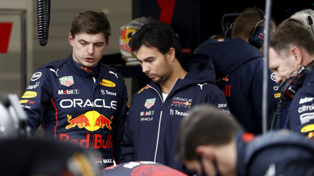 Max Verstappen and Sergio Perez in the garage at the RB18