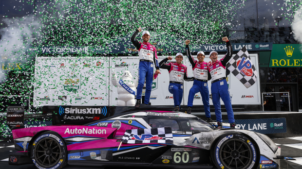 Tom Blomqvist and his team celebrate winning at Daytona