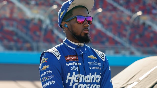 An image of NASCAR driver Rajah Caruth in Hendrickcars.com gear