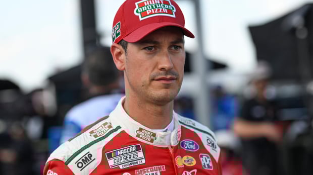 An image of NASCAR Cup Series driver Joey Logano staring into the distance