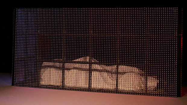 F1 car under a white blanket