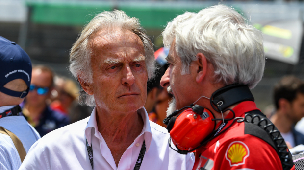 Ex-Ferrari chairman Luca di Montezemolo chats with engineers on the grid