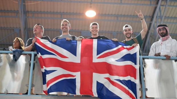 British fans fly the flag from a grandstand