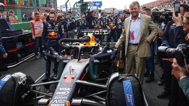 King Willem-Alexander posing with Verstappen's Red Bull