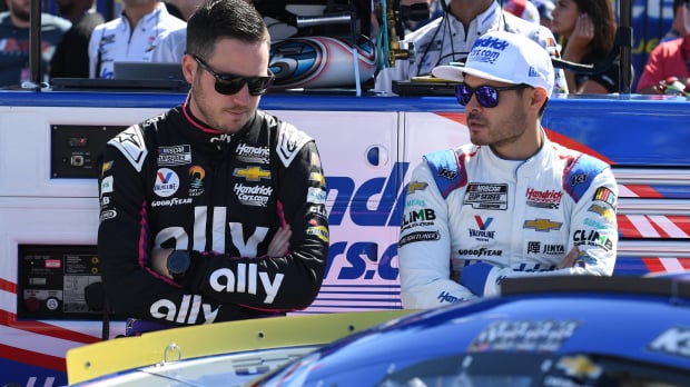 An image of Hendrick Motorsports drivers Alex Bowman and Kyle Larson looking disappointed
