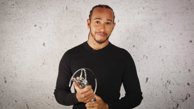 Lewis Hamilton with a Laureus award