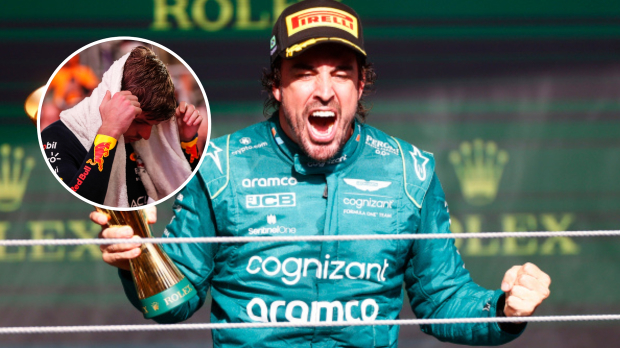 Max Verstappen has his head in his hands as Fernando Alonso celebrates