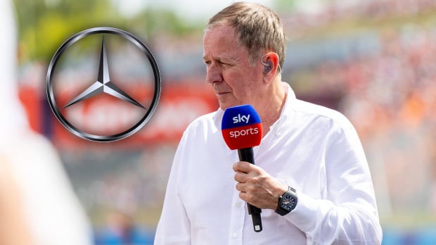 Brundle holding Sky Sports F1 microphone with silver and black Mercedes logo edited to his left