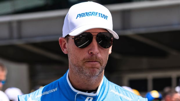 An image of NASCAR Cup Series star Denny Hamlin looking unhappy