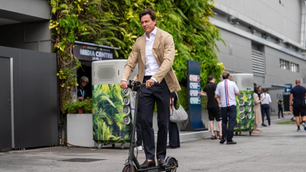 Toto Wolff races around the Singapore GP paddock on two wheels