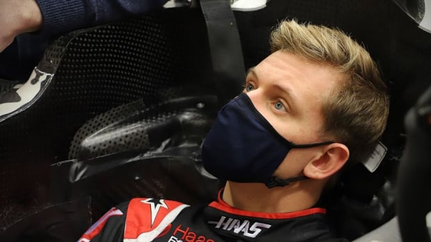 Mick Schumacher doing a seat fit with Haas 