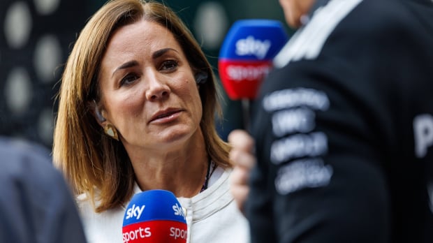 Natalie Pinkham looking serious in a closeup shot holding a Sky Sports microphone