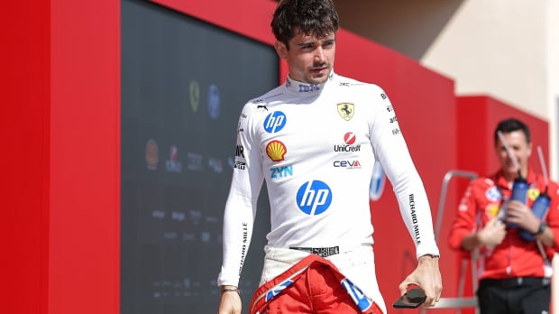 Charles Leclerc looks on in the paddock at the Sakhir Circuit