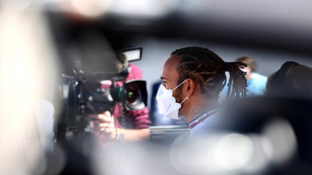 Lewis Hamilton talking with the press in Portugal