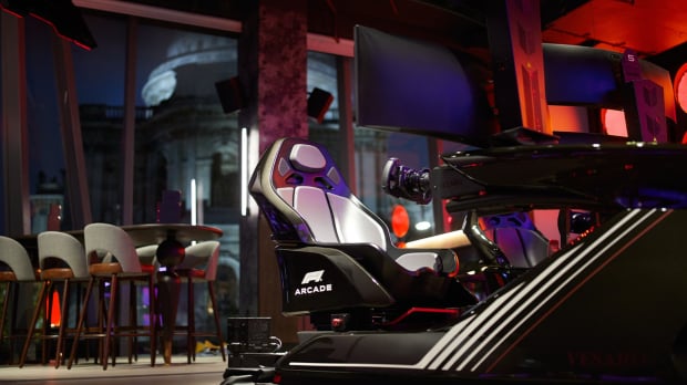 Image Credit: F1 Arcade. Affiliate image, do not use for other pieces please. F1 Arcade simulator with St Paul's Cathedral night view out the window — Photo: © Image Credit: F1 Arcade