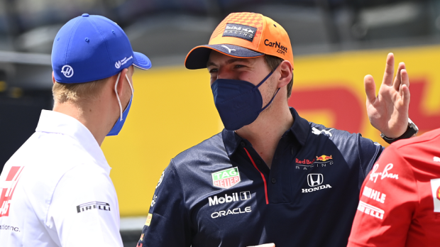 Mick Schumacher talking with Max Verstappen