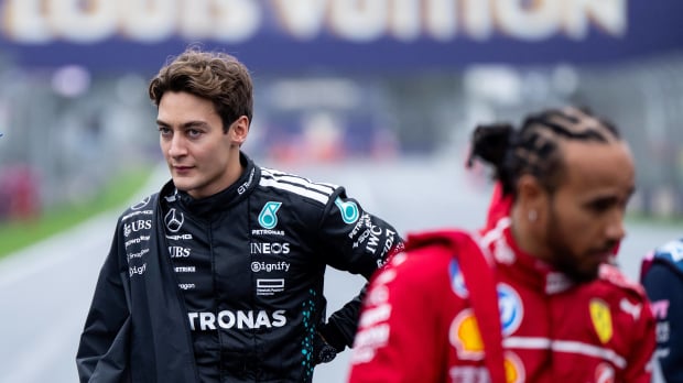Lewis Hamilton and George Russell in conversation before an F1 race