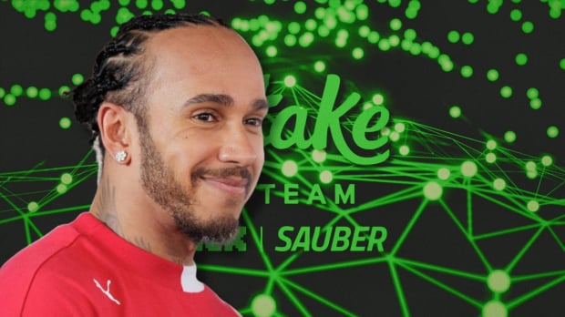 Lewis Hamilton is pictured in front of a Sauber logo