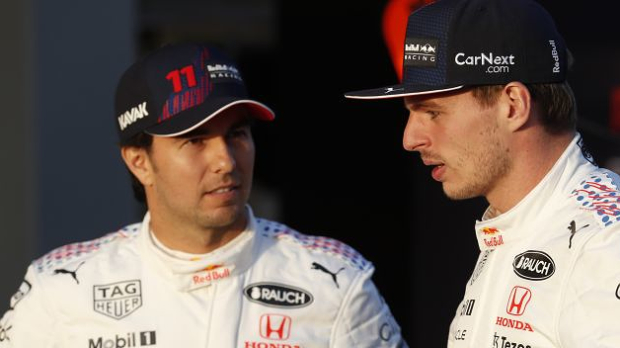 Verstappen and Perez posing in front of Turkish GP livery